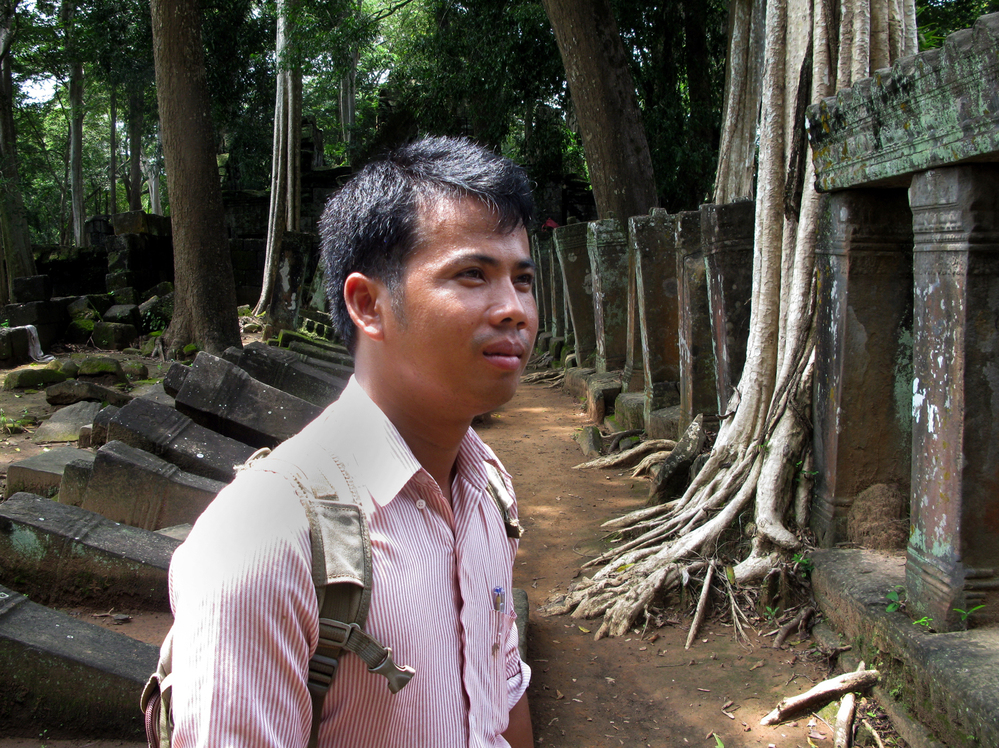 Archaeologist Phin Samnang, 29, surveys the ruins of Prasat Chen temple at Koh Ker. He says that unlike in earlier periods, Cambodia now has the means and duty to reclaim its priceless lost antiquities.