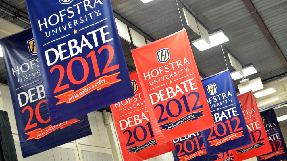 Banners hang inside the media center amid preparations for tonight's presidential debate at Hofstra University in Hempstead, N.Y.