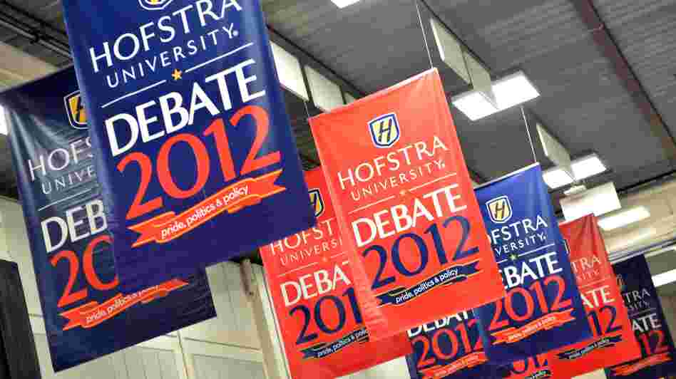 Banners hang inside the media center amid preparations for tonight's presidential debate at Hofstra University in Hempstead, N.Y.