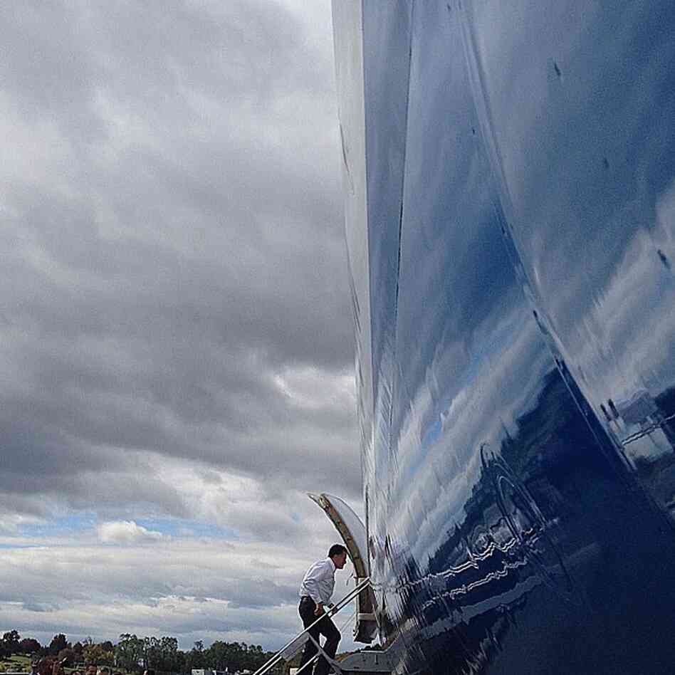 Mitt Romney boards campaign charter plane in Bedford, Ma., as he travels to Denver. @charlesdharapak