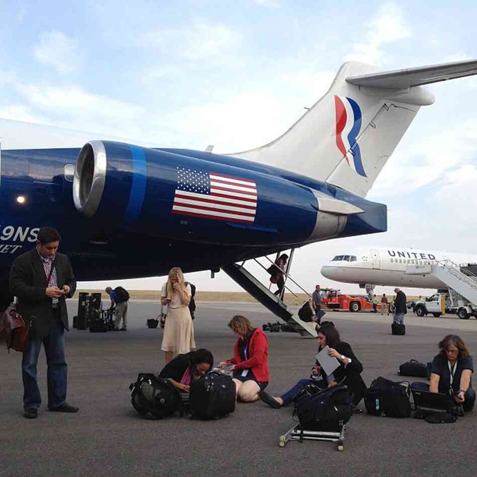 Campaign reporters file their stories on the tarmac in Denver after Mitt Romney took questions in flight. @charlesdharapak