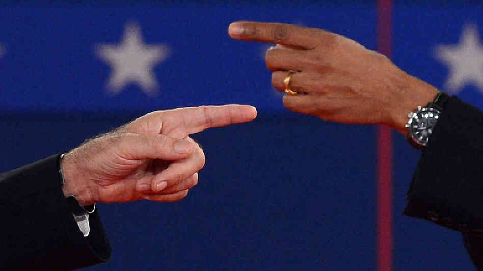 The fingers tell the story: At times, President Obama and Republican challenger Mitt Romney got very close Tuesday night during their exchanges.