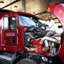 Errol Giwa, en route to Washington, D.C., fuels up and wipes down his windshield at the truck stop in Jessup, Md. He says in his 34 years as a truck driver, he has heard of many instances of human trafficking at truck stops but hasn't seen it with his own eyes. "If you are looking for that sort of thing, it's not hard to find on the road," Giwa says.