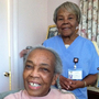 Onether Lowery, 80, (standing) is a home health aide for Rosalie Lewis, 86. As a whole, the aides are largely female and far older than women in the general workforce.