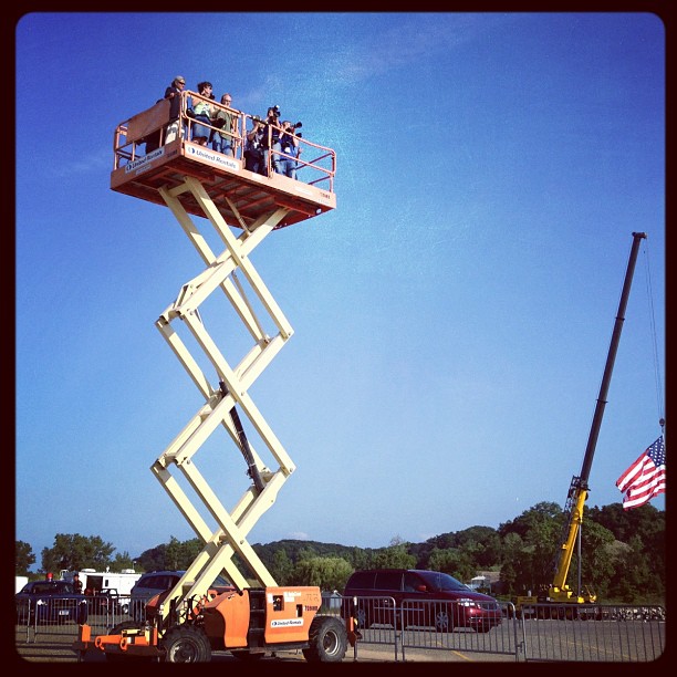 Photogs get a lift at Romney's last stop of the day, in Holland, Mich. <a href=