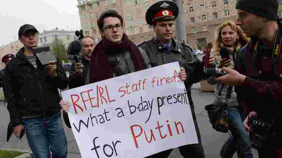 Police officers detain Kirill Filimonov, one of the supporters of Radio Liberty in Moscow during a recent protest. The service will stop AM radio broadcasts and will become an Internet operation. It can also be heard on short wave radio.