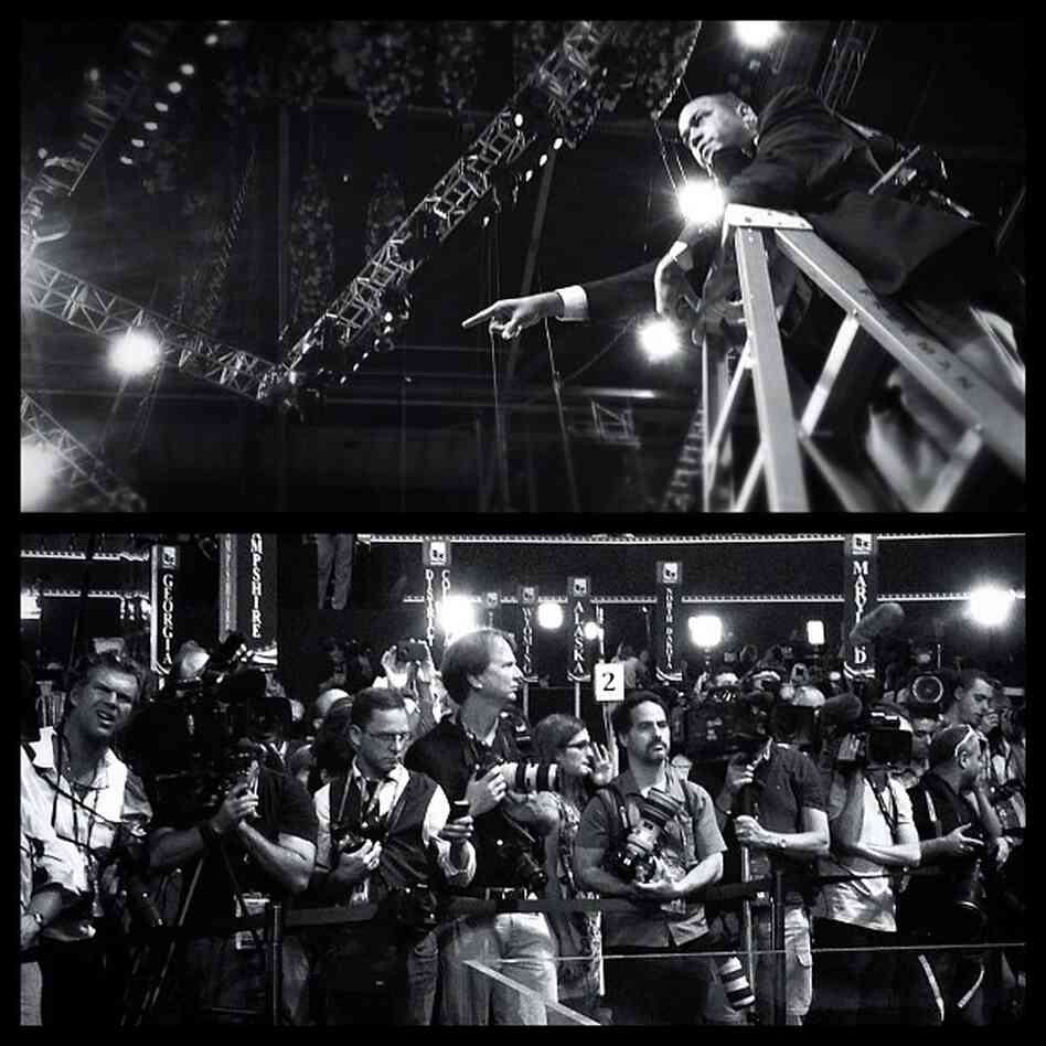 Romney Campaign | Romney campaign photographer Eric Draper organizes a group photo as shooters wait for the governor's sound check | RNC, Tampa, Florida. @somophoto
