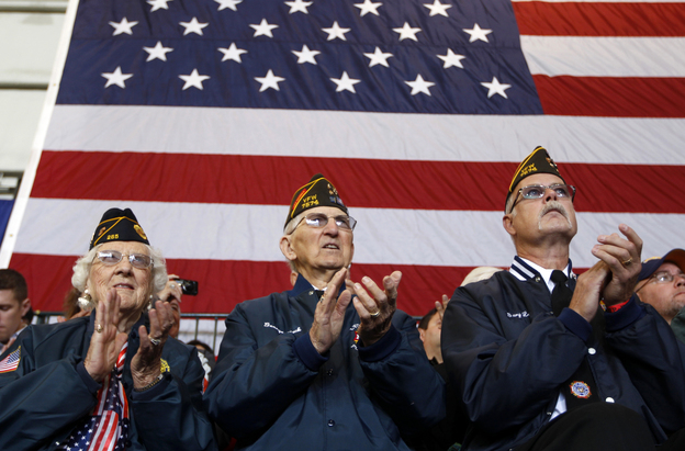 Veterans applaud at an Oct. 8 campaign event in Swanton, Ohio, for Republican vice presidential candidate Paul Ryan. Health care and unemployment are among veterans' chief concerns this election season, and both the Obama and the Romney campaigns have offered solutions.