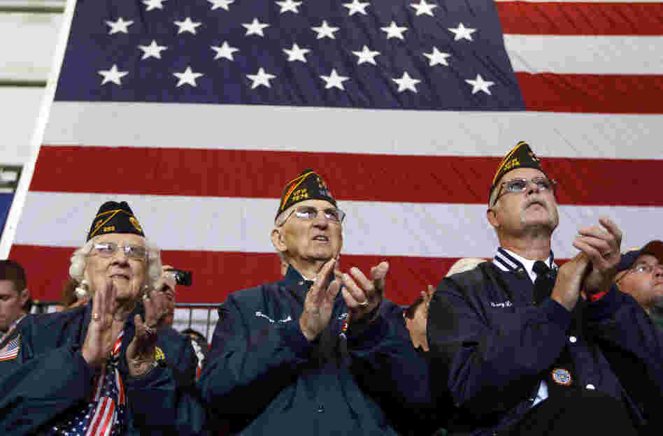 Veterans applaud at an Oct. 8 campaign event in Swanton, Ohio, for Republican vice presidential candidate Paul Ryan. Health care and unemployment are among veterans' chief concerns this election season, and both the Obama and the Romney campaigns have offered solutions.