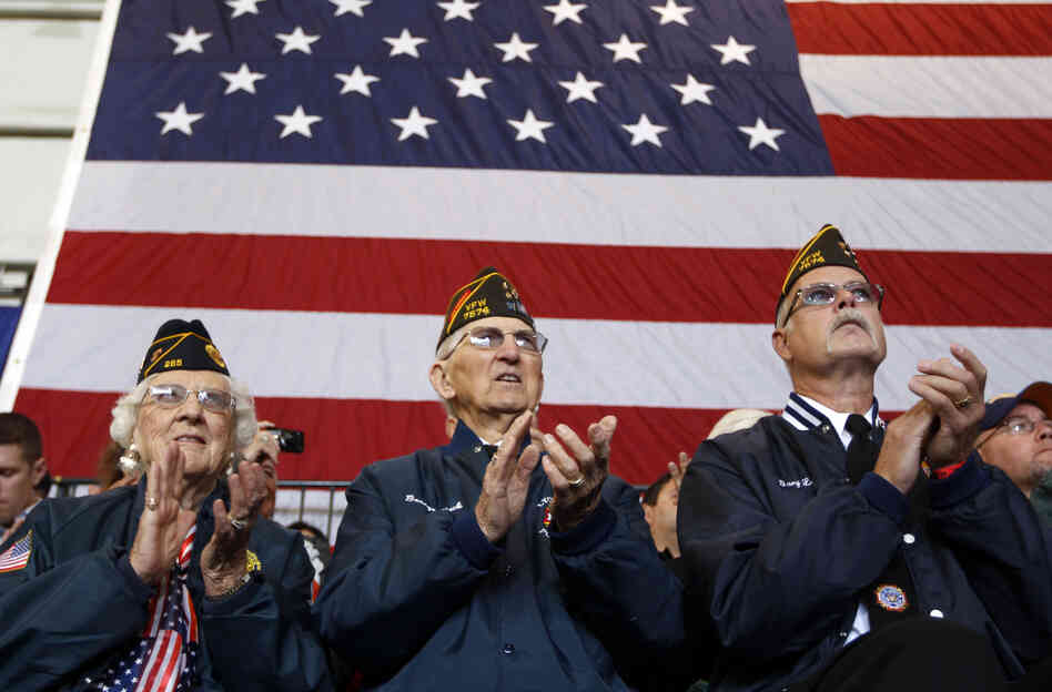 Veterans applaud at an Oct. 8 campaign event in Swanton, Ohio, for Republican vice presidential candidate Paul Ryan. Health care and unemployment are among veterans' chief concerns this election season, and both the Obama and the Romney campaigns have offered solutions.