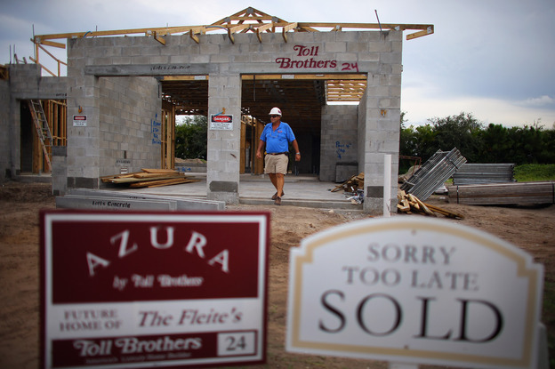 Construction worker Jim Castellano walks out of a Toll Brothers Inc. home he is working on in Boca Raton, Florida.