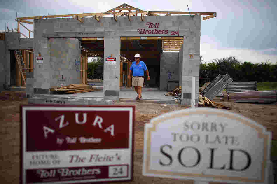 Construction worker Jim Castellano walks out of a Toll Brothers Inc. home he is working on in Boca Raton, Florida.