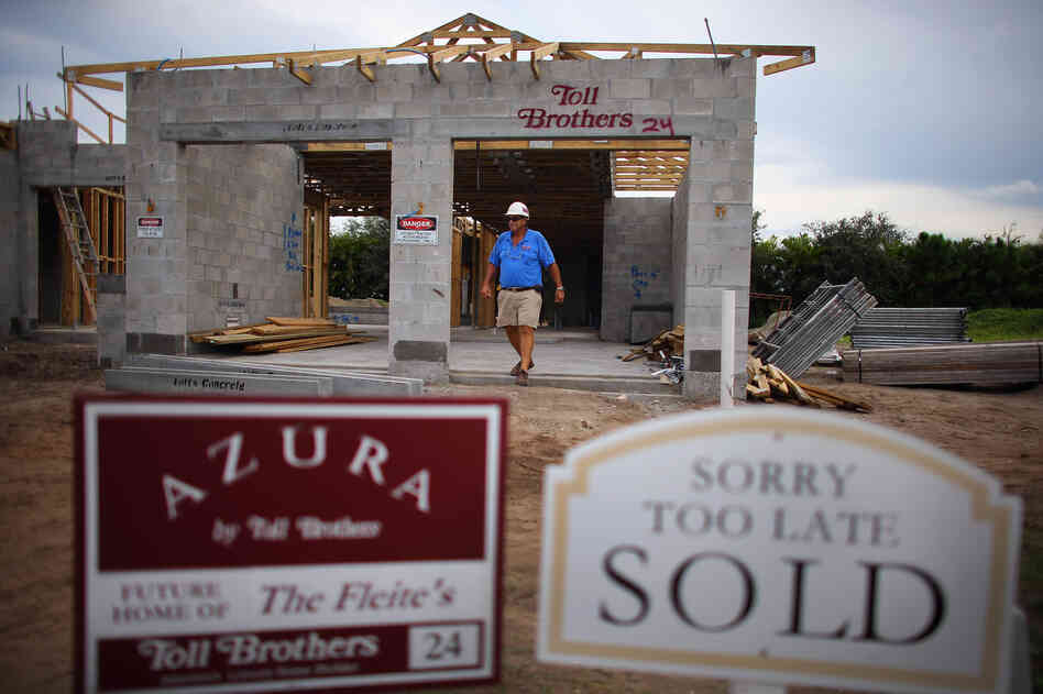Construction worker Jim Castellano walks out of a Toll Brothers Inc. home he is working on in Boca Raton, Florida.