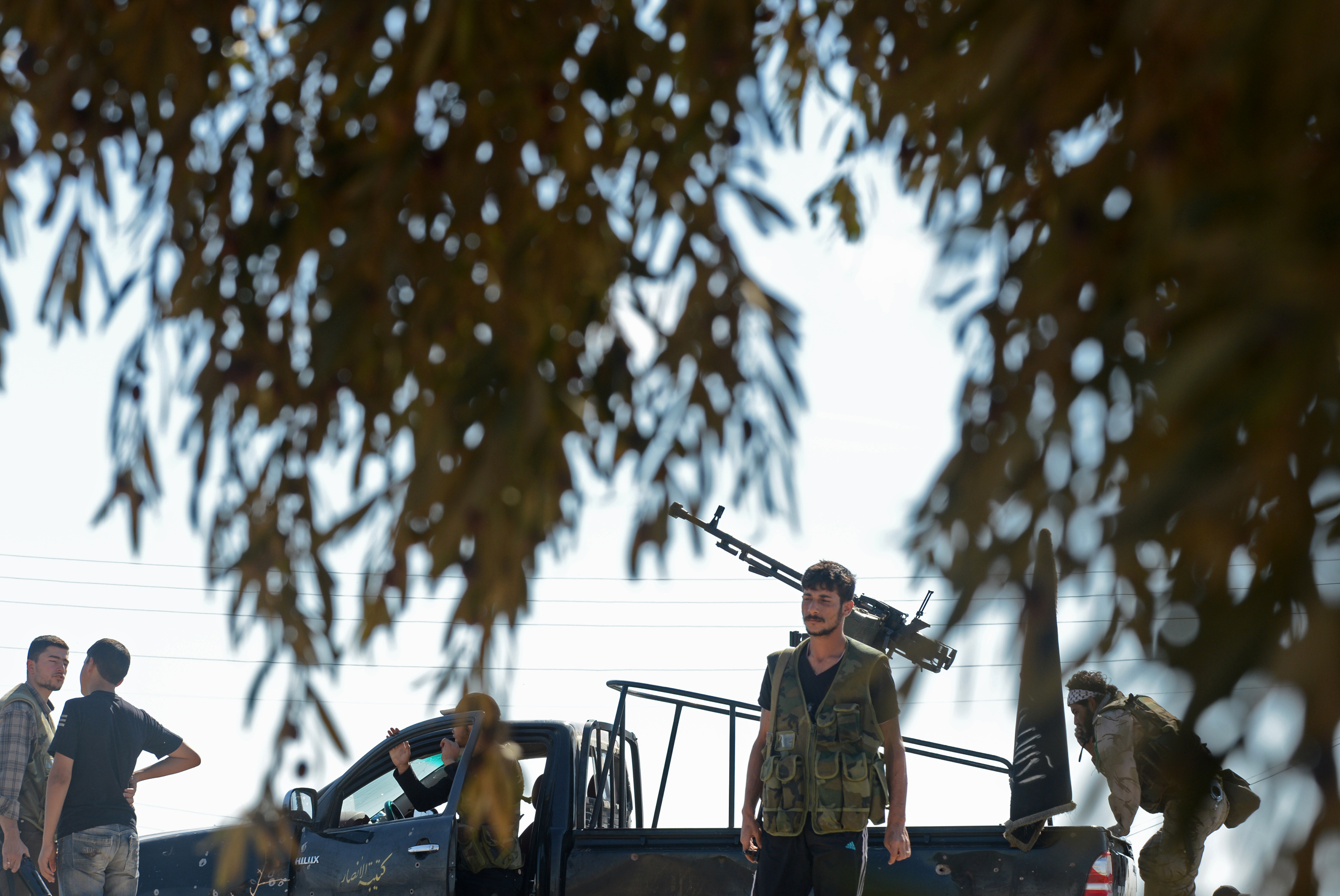 Syrian rebels head towards the frontline in Albab, 30 kilometres from the northeastern Syrian city of Aleppo, on Wednesday. Syrian rebels head towards the frontline in Albab, 30 kilometres from the northeastern Syrian city of Aleppo, on Wednesday.