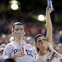 Fans wear President Obama and Mitt Romney masks at the Atlanta Braves-Miami Marlins game Sept. 25 in Atlanta. One of many quirky election year predictors is based on which candidate's likeness sells better as a Halloween mask.