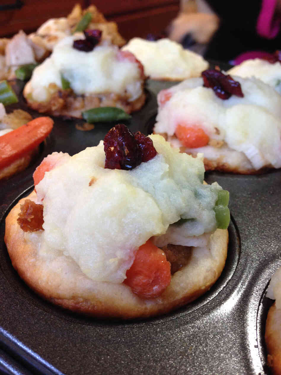 The Thanksgiving cupcake looks the most like your run-of-the-mill sweet cupcake. The recipe was created on the spot at our cupcake cook off: Biscuit dough is topped with stuffing, turkey and a crown of mashed potatoes.