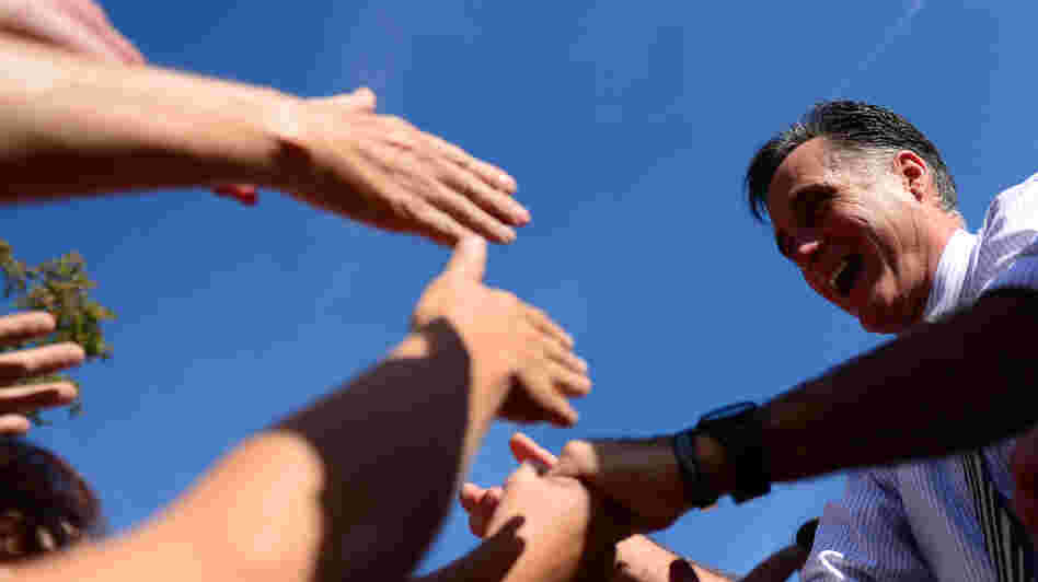 Mitt Romney greets supporters at a campaign rally Wednesday in Chesapeake, Va.