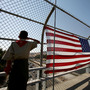 A Boy Scout salutes traffic as he stands next to a flag display on a freeway overpass September 11, 2008 in Lafayette, California. A Boy Scout salutes traffic as he stands next to a flag display on a freeway overpass September 11, 2008 in Lafayette, California.