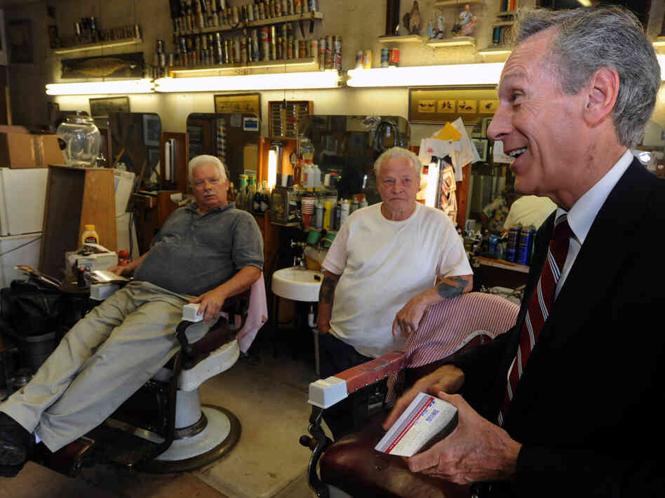 Constitution Party presidential candidate Virgil Goode (right) visits a barber shop while campaigning in Lynchburg, Va., in September.