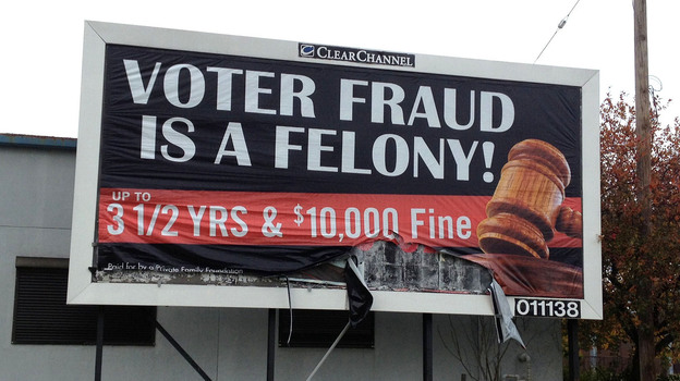 An anonymous "family foundation" is paying for billboards warning against voter fraud, like this one in a minority neighborhood on the east side of Cleveland. Clear Channel, which owns the space, says the anonymity violates its policies but it will not take the ads down.