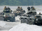 U.S. Marines drive amphibious armored personnel carriers in the Philippines on Oct. 9, as part of the annual joint exercises with Philippine counterparts. U.S. Marines drive amphibious armored personnel carriers in the Philippines on Oct. 9, as part of the annual joint exercises with Philippine counterparts.