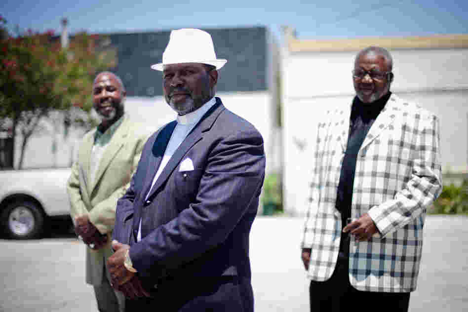 From left, Minister Anthony Davis, Pastor Eddie Walker and Minister James Major stand outside In Lord's Time Tabernacle Church in downtown Orlando. All three are convicted felons now working to get their civil rights restored.