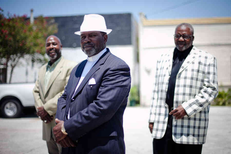 Ministers Anthony Davis (from left), Eddie Walker and James Major stand outside In Lord's Time Tabernacle Church in downtown Orlando. All three are convicted felons now working to get their civil rights restored.