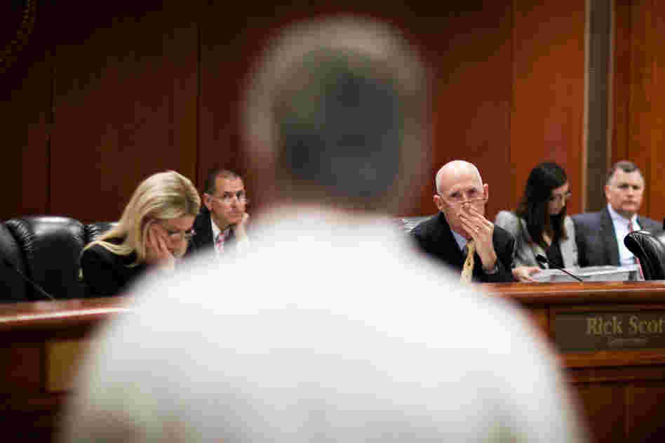 Florida Gov. Rick Scott listens to testimony from felons attempting to restore their right to vote at a clemency hearing in Tallahassee, Fla., in June. Florida Gov. Rick Scott listens to testimony from felons attempting to restore their right to vote at a clemency hearing in Tallahassee, Fla., in June.