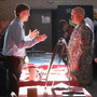 Sgt. Ben Roberts (center), recently returned from Afghanistan, speaks with Chick-fil-A manager Michael Sims at a military job fair in Columbia, S.C., in January. Sgt. Ben Roberts (center), recently returned from Afghanistan, speaks with Chick-fil-A manager Michael Sims at a military job fair in Columbia, S.C., in January.