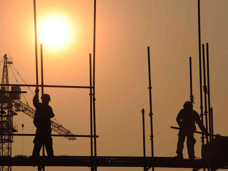 Workers scramble on a scaffold at a construction site in Hefei, central China's Anhui province, last month. China has approved a massive infrastructure package worth more than $158 billion, state media said in September, as the government seeks to boost the flagging economy. Workers scramble on a scaffold at a construction site in Hefei, central China's Anhui province, last month. China has approved a massive infrastructure package worth more than $158 billion, state media said in September, as the government seeks to boost the flagging economy.