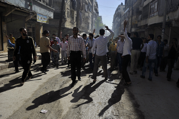 Syrian protesters shout slogans during an anti-regime demonstration in the northern city of Aleppo on Friday.
