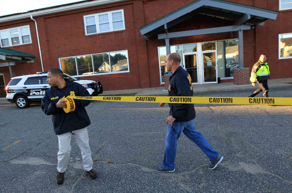 Federal agents investigate the offices of the New England Compounding Center in Framingham, Mass., on Tuesday. The company's steroid medication has been linked to a deadly meningitis outbreak. Federal agents investigate the offices of the New England Compounding Center in Framingham, Mass., on Tuesday. The company's steroid medication has been linked to a deadly meningitis outbreak.
