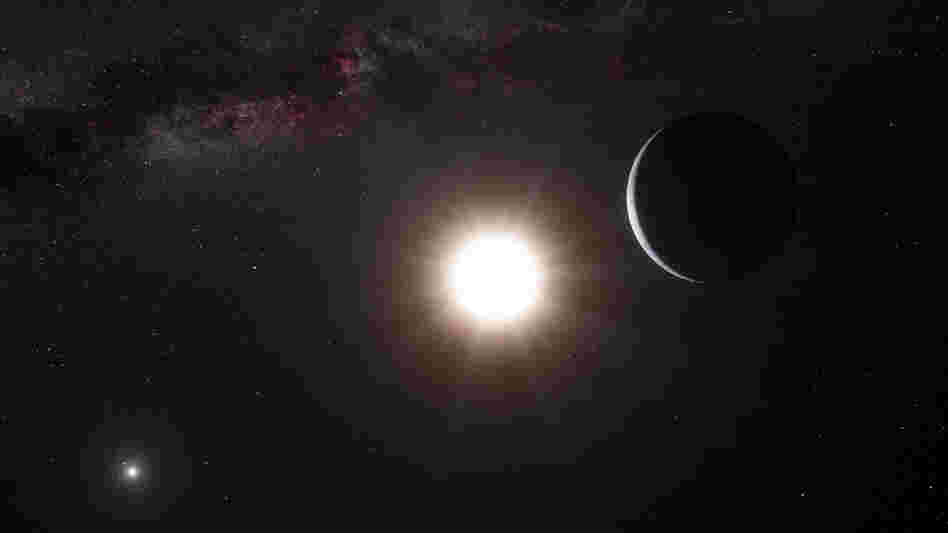 An artist's impression shows a planet, right, orbiting the star Alpha Centauri B, center, a member of the triple star system that is the closest to Earth.