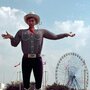 Big Tex watches over the crowd at one end of the State Fair of Texas midway in 1997, in Dallas. Big Tex watches over the crowd at one end of the State Fair of Texas midway in 1997, in Dallas.