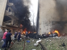 Lebanese firefighters extinguish burning cars in Beirut following a huge bomb explosion. Lebanese firefighters extinguish burning cars in Beirut following a huge bomb explosion.