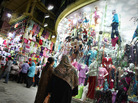 Nighttime shoppers pause to look at a display at Cairo's Ataba market in May 2011. The government says shops must close earlier in order to save scarce electricity, but many Cairo residents are complaining. Nighttime shoppers pause to look at a display at Cairo's Ataba market in May 2011. The government says shops must close earlier in order to save scarce electricity, but many Cairo residents are complaining.