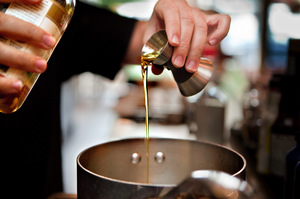 Then he adds 2 ounces of oil, in this case, toasted sesame oil.