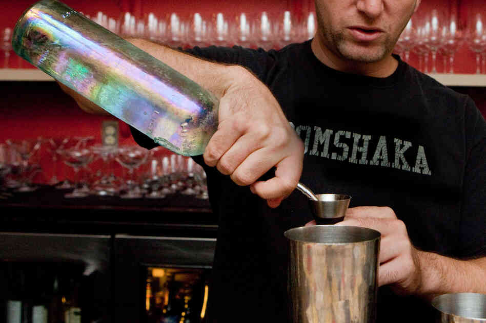 When he's ready to serve, Berner pours the alcohol into a cocktail shaker with ice and the other ingredients.