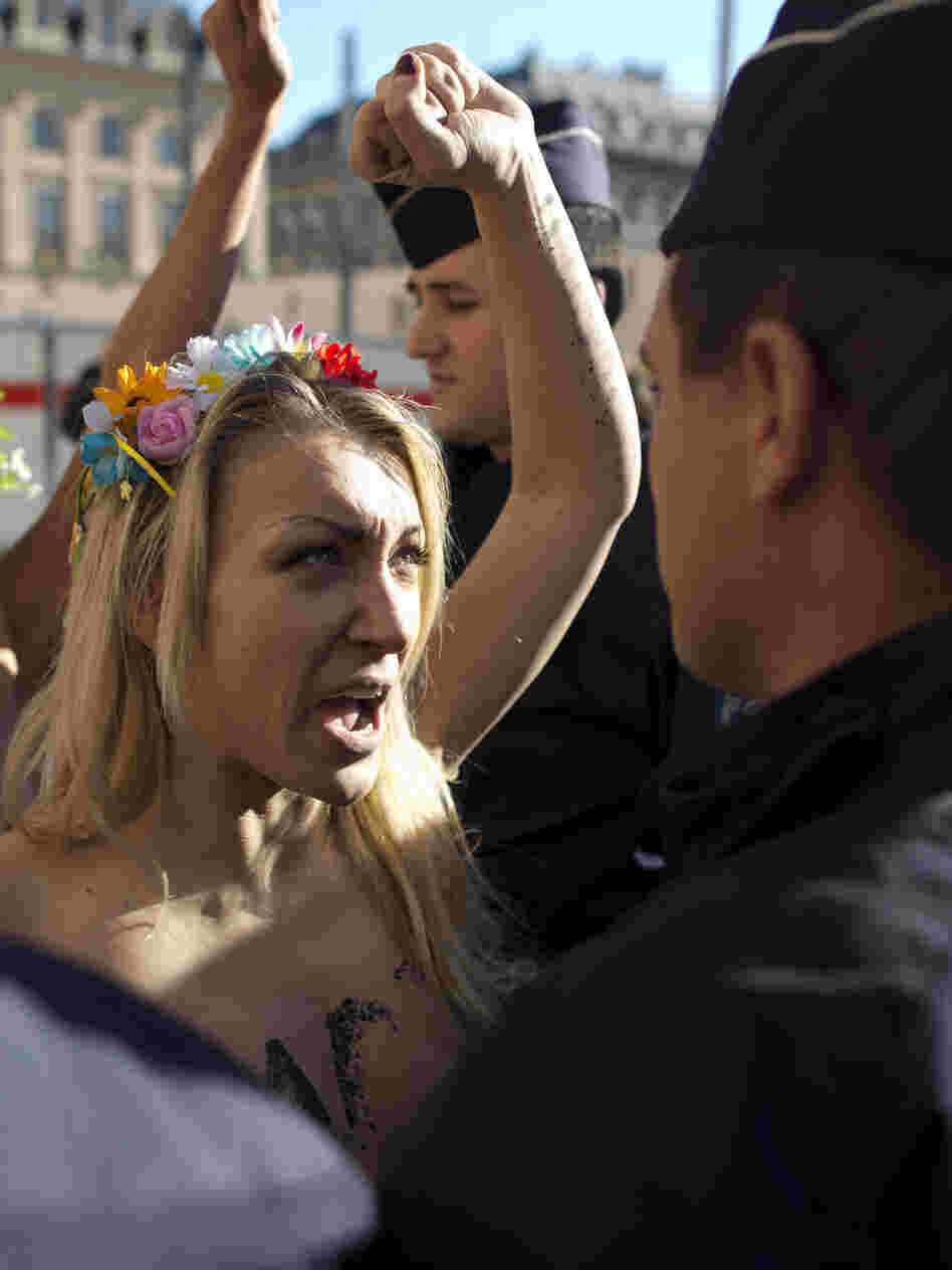 Topless activists from Femen protest a court ruling that acquitted 10 of 14 men accused of repeatedly gang-raping two teenagers in a Paris suburb.