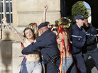 French policemen on Oct. 15 detain topless activists from the group Femen who are protesting the verdict in a gang rape trial. The group was established in Ukraine but is now setting up an office in Paris. French policemen on Oct. 15 detain topless activists from the group Femen who are protesting the verdict in a gang rape trial. The group was established in Ukraine but is now setting up an office in Paris.