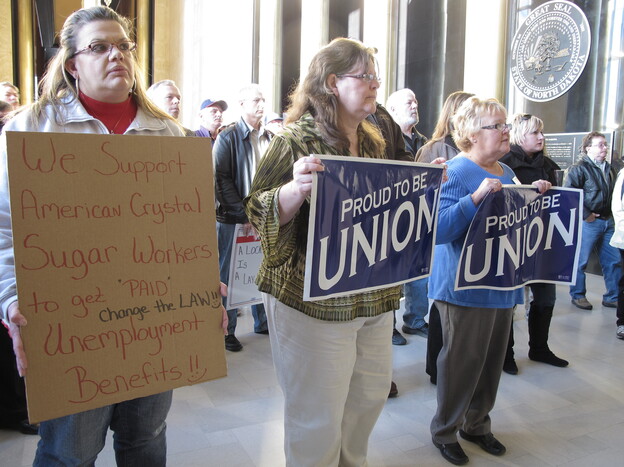 Supporters of American Crystal Sugar Co. workers, who have been locked out of the company's sugar beet processing plants since 2011, rally in the North Dakota Capitol.
