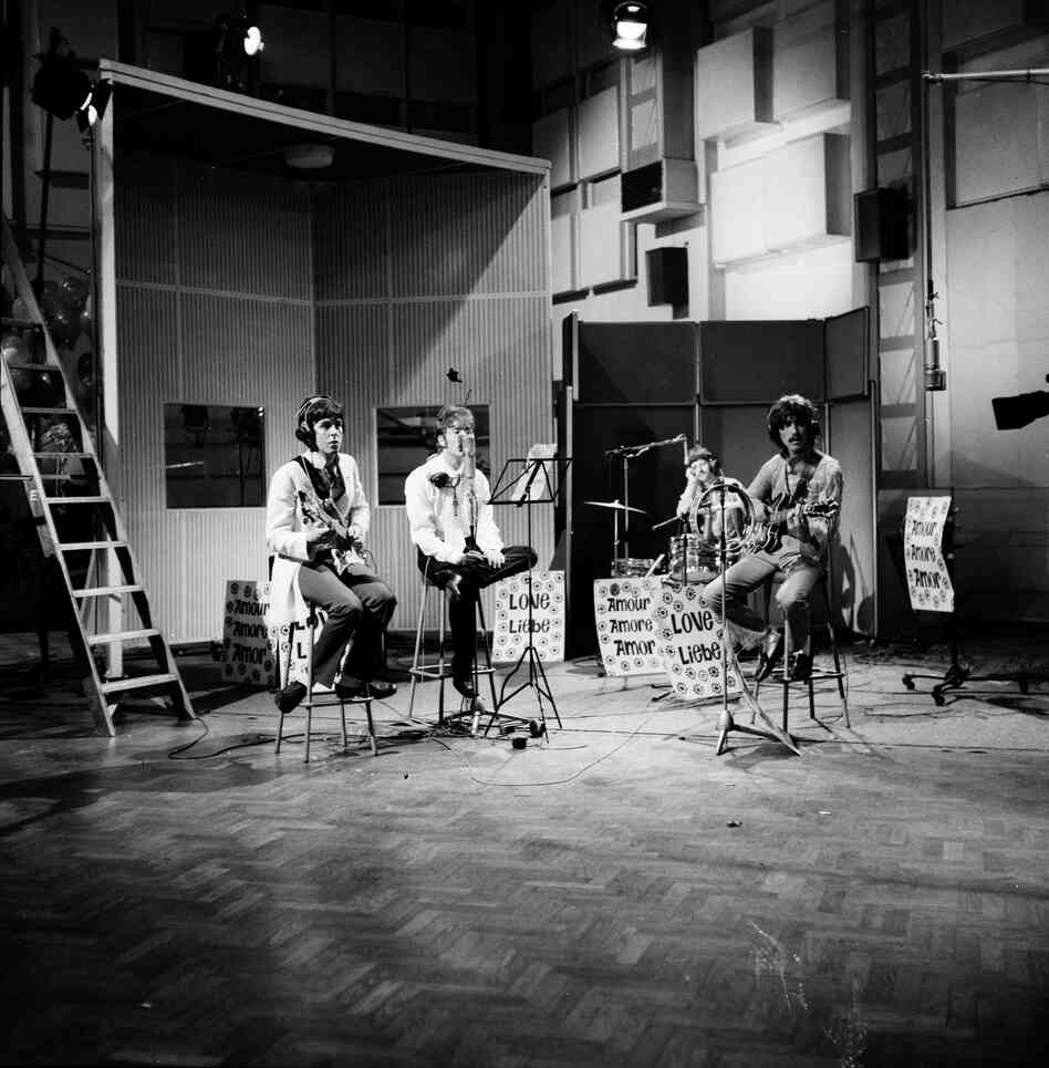The Beatles rehearse in Studio 1 ahead of the Our World broadcast (1967), the first international satellite television production. This ambitious project showcased creative artists from 19 countries and was viewed by close to 400 million people around the globe — the largest ever TV audience at the time.