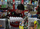 An Iranian boy holds a tray of eggs at a grocery store in Tehran last month. From Sunday, Sept. 30, to Monday, Oct. 1, the Iranian currency lost nearly one-third of its value against the dollar. An Iranian boy holds a tray of eggs at a grocery store in Tehran last month. From Sunday, Sept. 30, to Monday, Oct. 1, the Iranian currency lost nearly one-third of its value against the dollar.
