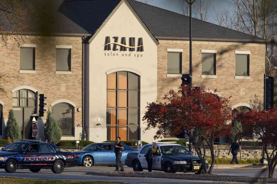 Police personnel work outside the Azana Salon and Spa where three people were killed and four others wounded after a mass shooting on Sunday in Brookfield, Wisconsin.