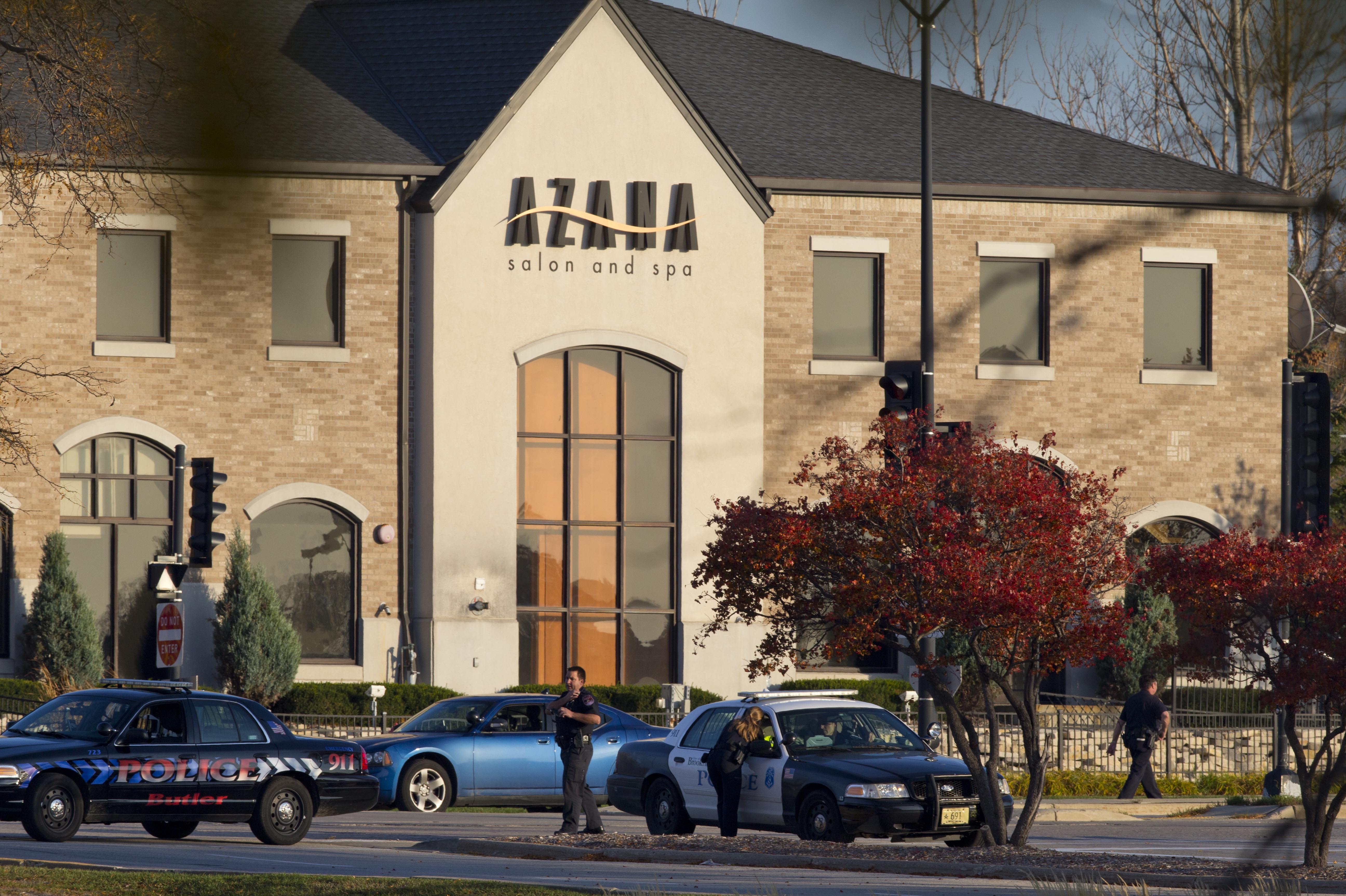 Police personnel work outside the Azana Salon and Spa where three people were killed and four others wounded after a mass shooting on Sunday in Brookfield, Wisconsin. Police personnel work outside the Azana Salon and Spa where three people were killed and four others wounded after a mass shooting on Sunday in Brookfield, Wisconsin.