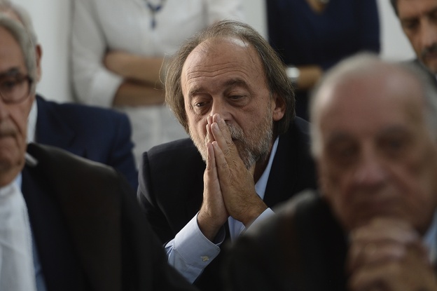 One of the indicted, Bernardo De Bernardinis, who was deputy chief of Italy's Civil Protection Department, reacts during a his trial.