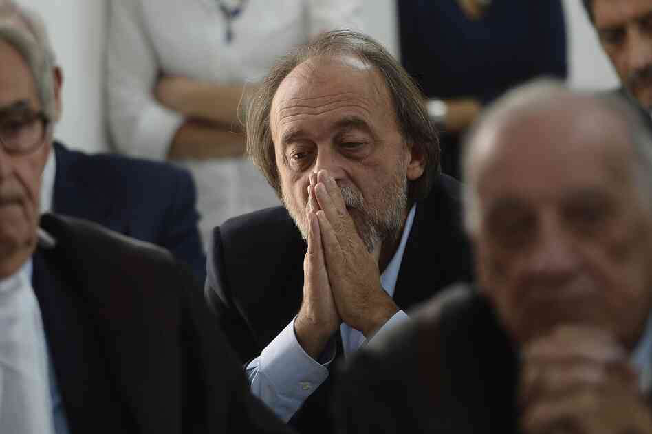 One of the indicted, Bernardo De Bernardinis, who was deputy chief of Italy's Civil Protection Department, reacts during a his trial.