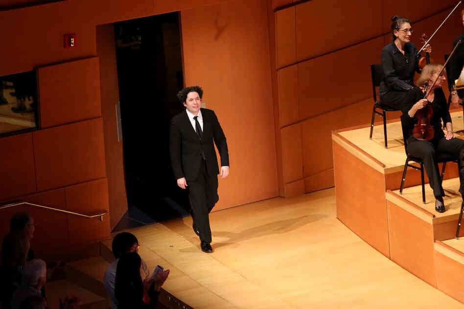 Dudamel comes back onstage to receive the audience's cheers at the end of The Rite of Spring.