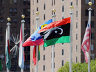 The flag of Libya's National Transitional Council (second from right) flies outside the United Nations headquarters building in New York. The flag of Libya's National Transitional Council (second from right) flies outside the United Nations headquarters building in New York.