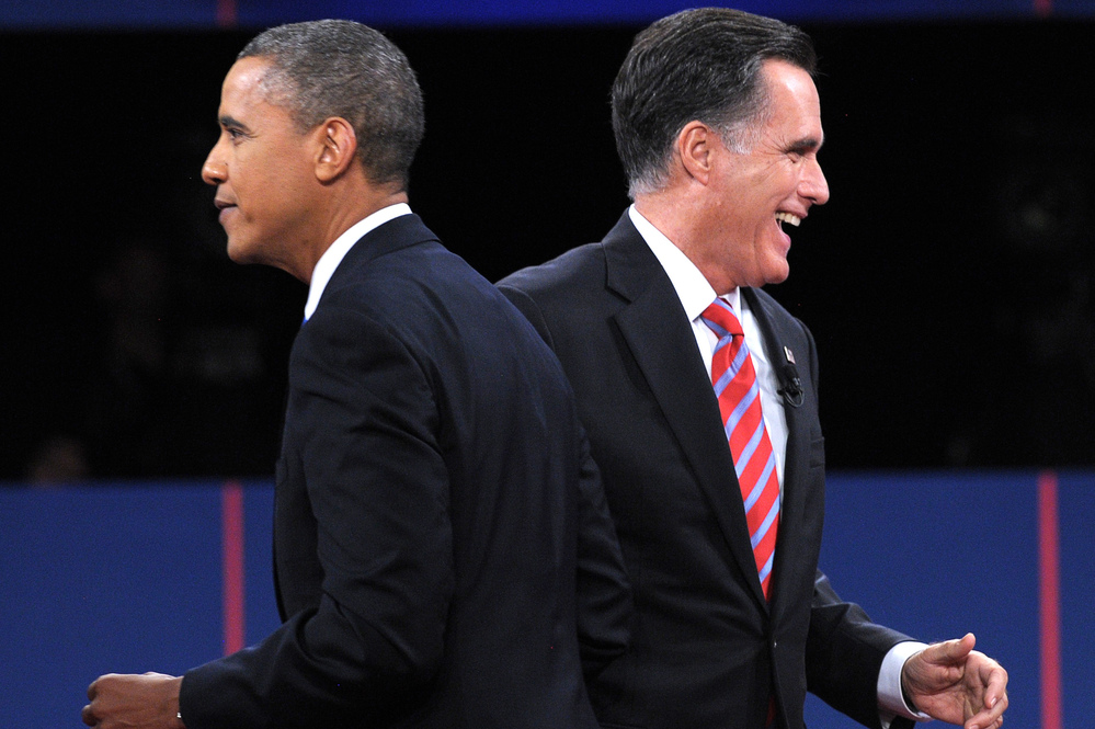 President Obama and GOP presidential nominee Mitt Romney walk away after they greet each other at the end of the third presidential debate in Boca Raton, Fla., on Monday.